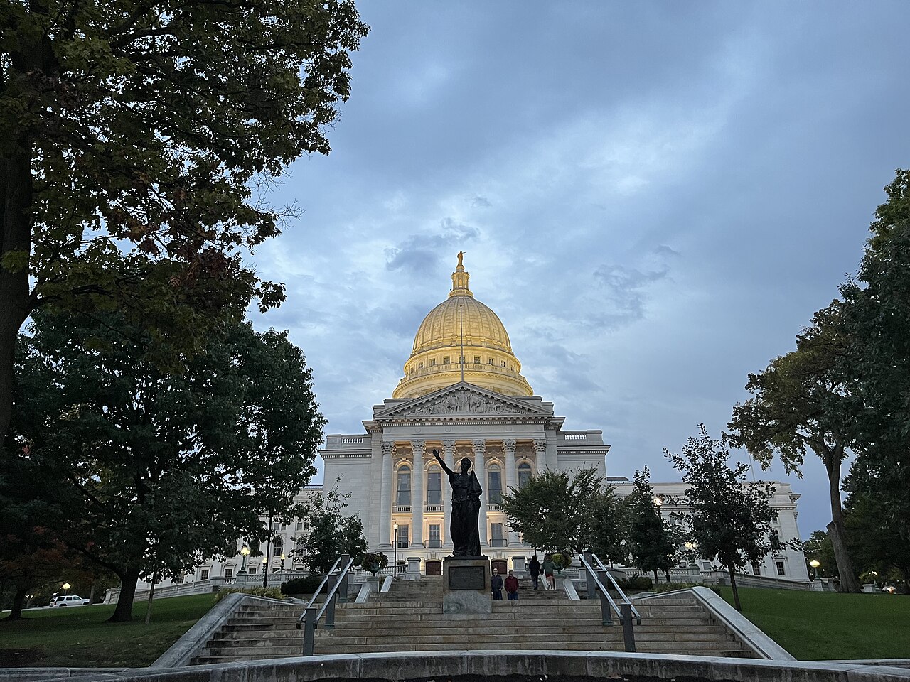 The Wisconsin State Capitol in Madison, Wisconsin, with the 'Forward' statue in the foreground